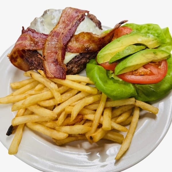 Bacon cheeseburger with a side of fries and a lettuce wrap with avocado and tomato.